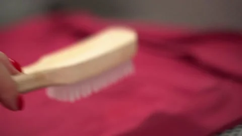 Midsection of female worker standing at workplace with professional dry cleaning Stock Footage 152963262