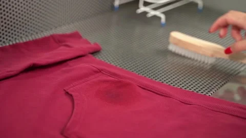 Midsection of female worker standing at workplace with professional dry cleaning Stock Footage 154963934