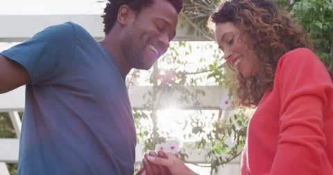 Midsection of happy man proposing to woman with ring Stock Footage 336241411