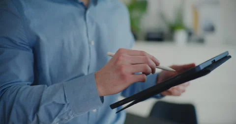 Midsection of male entrepreneur using digital tablet with stylus Stock Footage 267303944