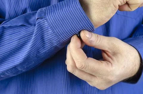 Midsection Of Man Buttoning Sleeve. Stock Photos