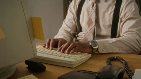 Midsection of Man Typing on Vintage Computer Keyboard in Retro Office Stock Footage 341419248