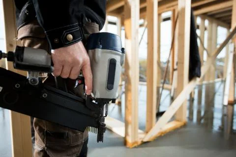 Midsection Of Professional Carpenter Holding Drill Machine Stock Photos