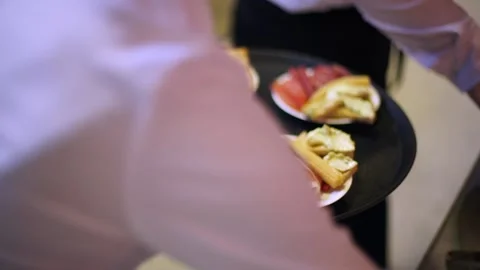 Midsection of professional waiters in uniform serving snacks during buffet Stock Footage 159366233