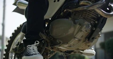 Midsection shot of man sitting and driving on motorcycle in slow motion, Japan Stock Footage 124709356