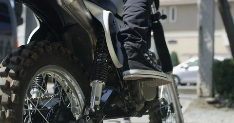 Midsection shot of man sitting on motorcycle in slow motion, Japan Stock Footage 124712679