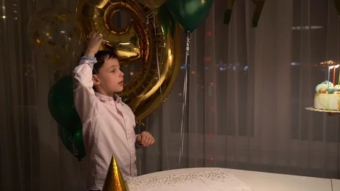Midsection of sweet cheerful toddler boy, blowing candles on cake and clapping Stock Footage 101457485