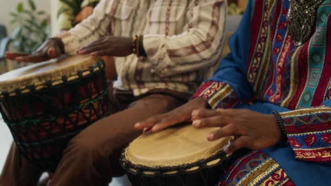 Midsection of Two Unknown Men Playing Djembe Drums Celebrating African Culture Stock Footage 319890976