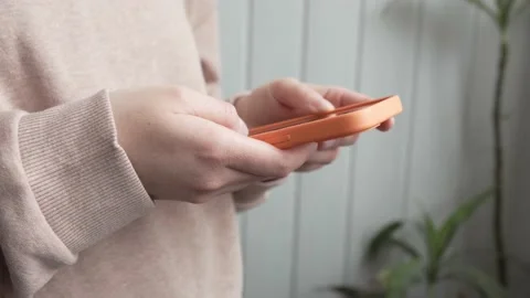 Midsection of unknown caucasian woman using smartphone mobile phone for tex.. Stock-Footage 234636174