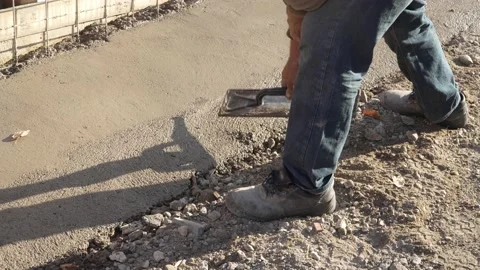 Midsection of unknown man hold shovel putting cement concrete on the building Stock Footage 220999270