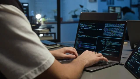 Midsection of Unknown Tech Specialist Programming on Laptop in Office at Night Stock Footage 329613972