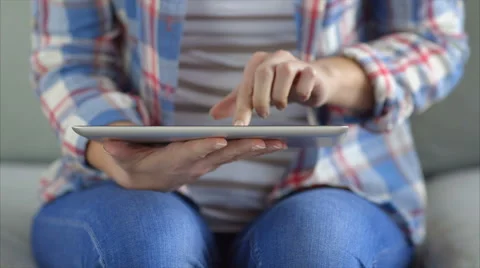 Midsection of woman picking up and using digital tablet Stock Footage 54783322