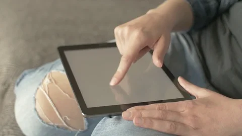 Midsection Of Woman Scrolling Screen On Tablet Computer Stock Footage 79657536