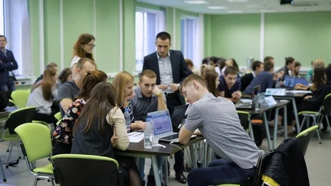 The midst of discussions of the workshop. A team of students together with the Stock Footage 70872364