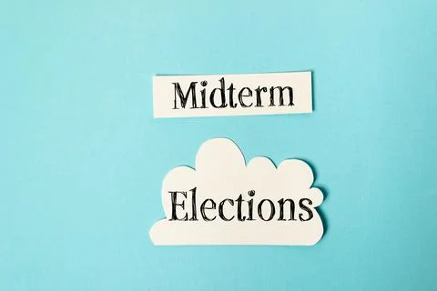 Midterm elections text displayed on a blue background, featuring a cloud shape, Stock Photos