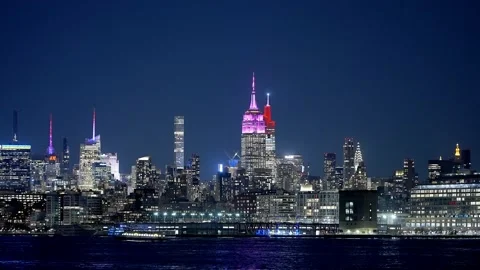 Midtown Manhattan with Empire State Building at night - street photography 動画素材 234565254