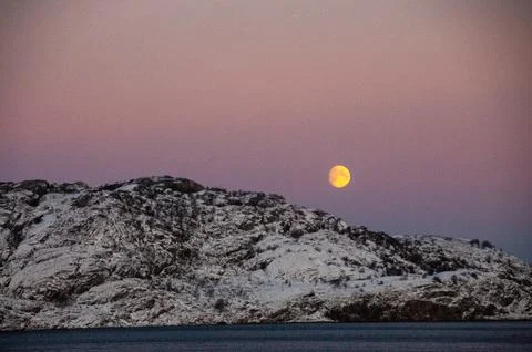 Midwinter moon over Bodo Stock Photos