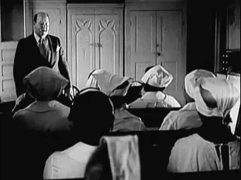 Midwives are trained, a grocer distributes a flyer and postings inform African Vídeo Stock 79459741