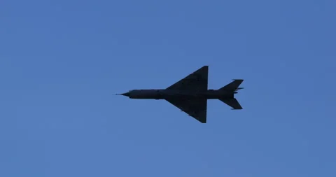 MiG21 Fighter Jet in Flight Showcasing Delta Wing Used in Cold War Conflicts Stock Footage 295760946