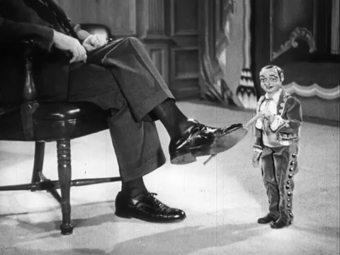 Migel, puppet informs Mathew about coffee being packed - 1938 Stock Footage 95816343