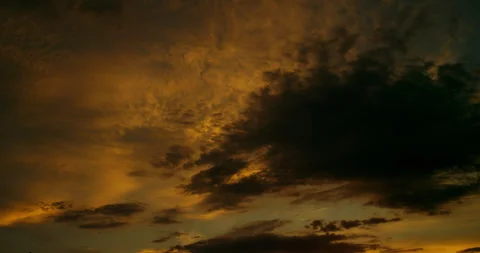 Mighty cloudscape at the golden hour with a darkened altocumulus cloud. Stock Footage 340251684