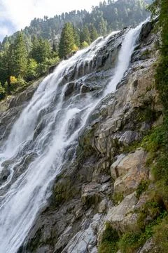 Mighty Grawa Waterfall Cascades Down Rocky Cliff Face in Stubai Valley Stock Photos