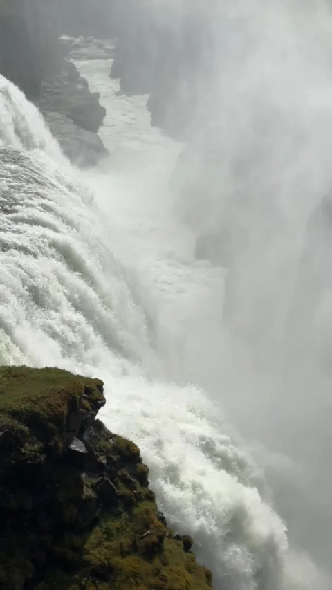 Mighty Gullfoss roars through a rugged Icelandic gorge, sending glacial spray  Stock Footage 312232919
