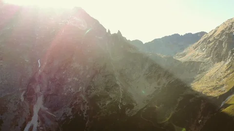 Mighty powerful mountains at sunset. Sun is coming from the hills. Stock Footage 120581908