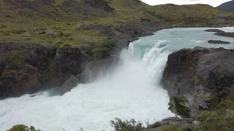 Mighty waterfall on river and close high mountain peak, Patagonia, Chile Stock Footage 137958878