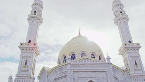 Mighty White Mosque on square reaches clouds in sky Stock Footage 230693020