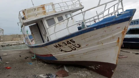 Migrant boats stranded Stock Footage 108635348