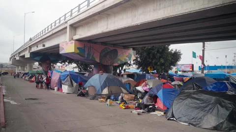 Migrant camp on the US Mexico Border with Tijuana Stock Footage 162810615