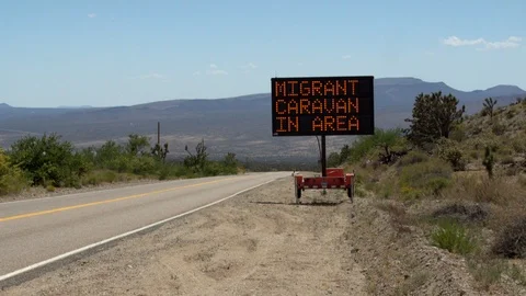 Migrant Caravan In Area - electronic road sign - 4K Stock Footage