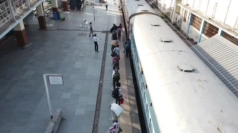 Migrant workers Covid 19 Lockdown India special Train Bus back home police duty. Video stock 130795115