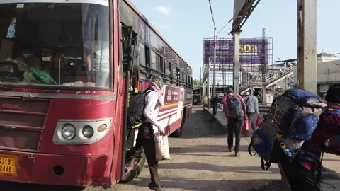 Migrant workers Covid 19 Lockdown India special Train Bus back home police duty. Stock Footage 130795434