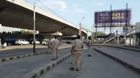 Migrant workers Covid 19 Lockdown India special Train Bus back home police duty. Video stock 130796931