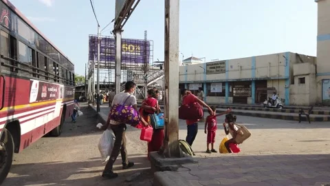 Migrant workers Covid 19 Lockdown India special Train Bus back home police duty. Stock Footage 130796980