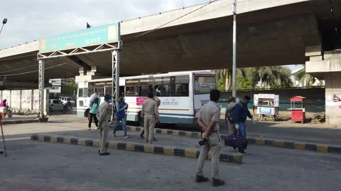 Migrant workers Covid 19 Lockdown India special Train Bus back home police duty. Video stock 130797119