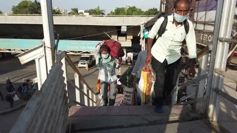 Migrant workers Covid 19 Lockdown India special Train Bus back home police duty. Video stock 130846613