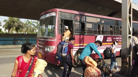 Migrant workers Covid 19 Lockdown India special Train Bus back home police duty. Video stock 130847647