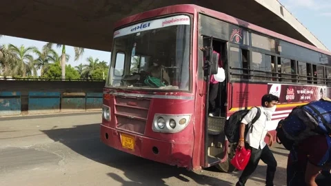 Migrant workers Covid 19 Lockdown India special Train Bus back home police duty. Stock Footage 130847716