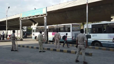 Migrant workers Covid 19 Lockdown India special Train Bus back home police duty. Stock Footage 130851609