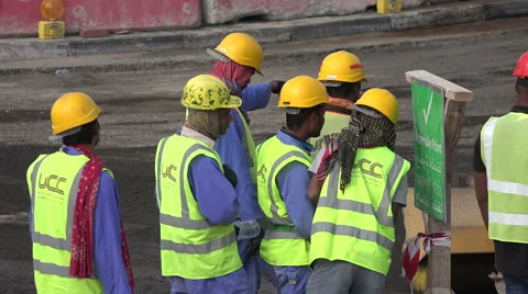 Migrant workers gather at construction site in Doha, Qatar Stock Footage 49008125