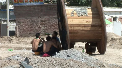 Migrant workers lunch break, Beijing, China Stock Footage 56591452