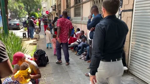 Migrants from Haiti wait to request refuge in Mexico City, Mexico 4K Stock Footage 161444366