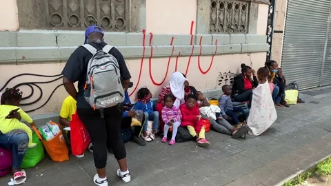 Migrants from Haiti wait to request refuge in Mexico City, Mexico 4K Stock Footage 161444390