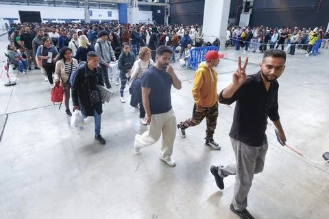 Migrants queue to obtain documents needed for their regularization, Lhospitalet  스톡 사진