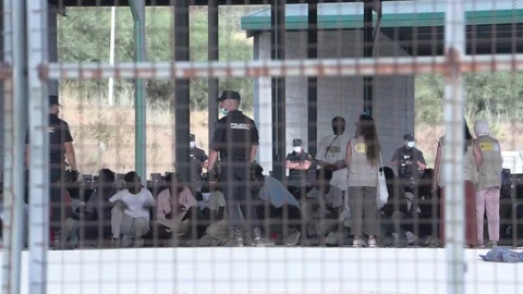 Migrants relocated from Spain's Ceuta beach arrive at Loma Colmenar, Ceuta, ES - 스톡 동영상 342815133