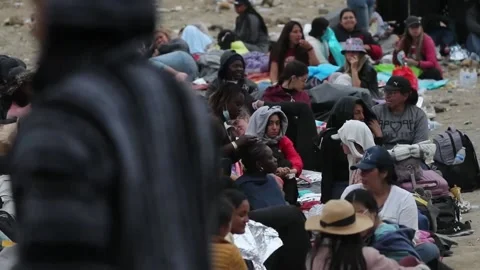 Migrants stranded in no man's land on US-Mexican border, San Diego, US - 13 May  Stock Footage 241068735