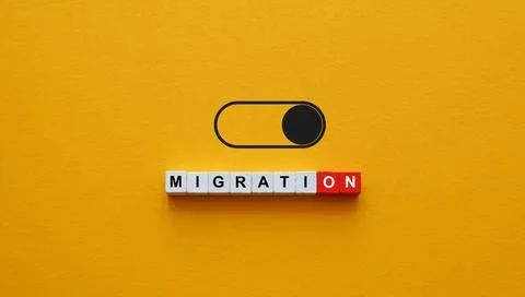 Migration word and toggle switch for immigration policy debate. Stock Photos